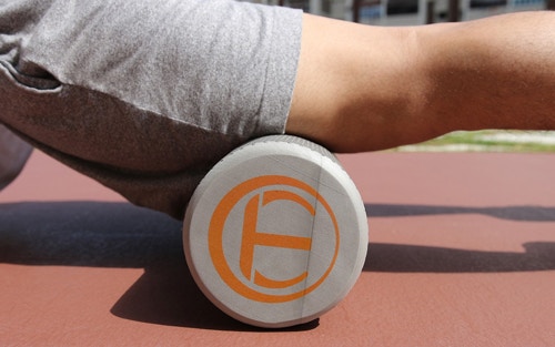 person using a foam roller for myofascial release