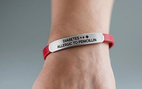 medical alert bracelet on a person's wrist - emergency treatment in case of adrenal crisis